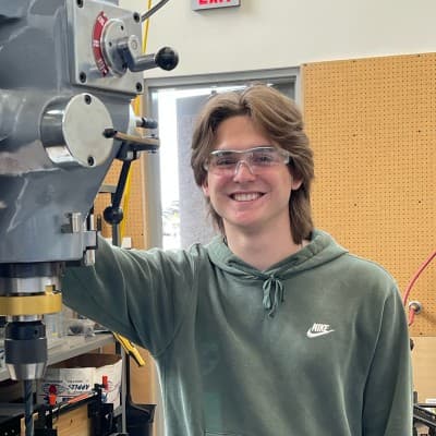 Camden Galen standing in a machine shop