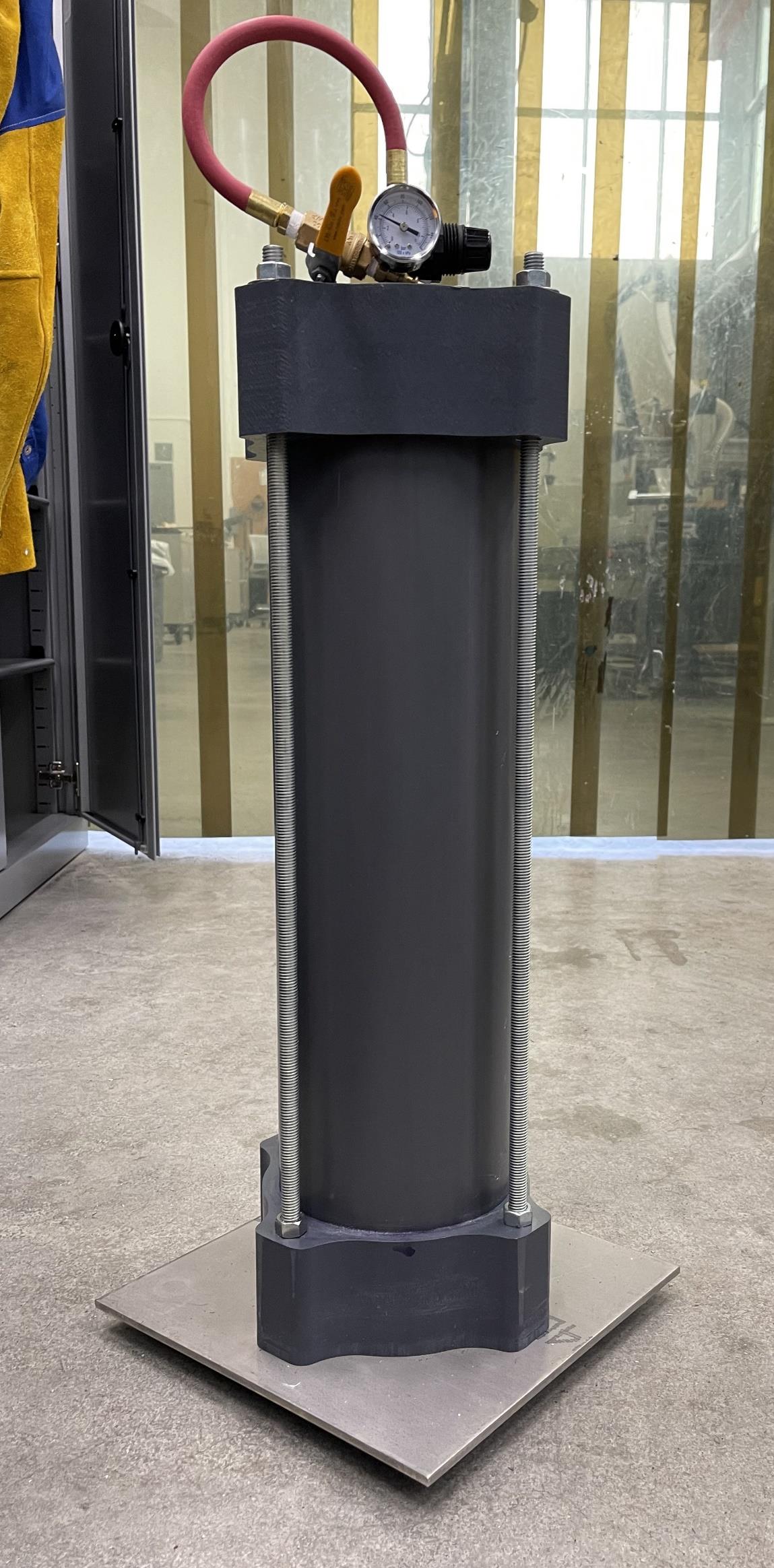 Completed hydrostatic pressure vessel standing upright in the lab